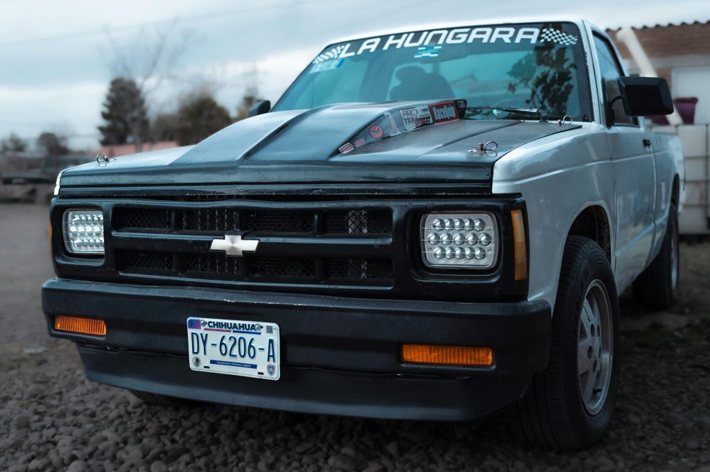 Front view of a classic white Chevrolet pick-up truck parked outdoors in Nuevo Casas Grandes, Chihuahua.